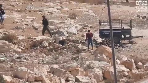 Armed Israeli Citizen opens fire directly at a Palestinian in Masafer Yatta, West Bank..