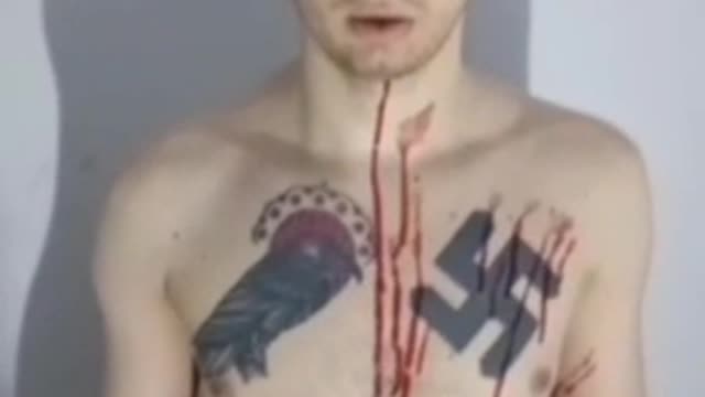 A captive Ukrainian neo-Nazi in all his tattooed glory.