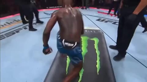 Israel Adesanya carve a cross into Monster Energy Can