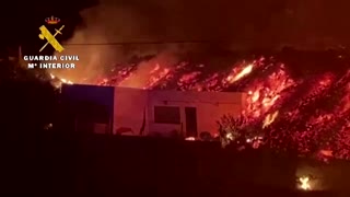 Watch a lava stream destroy a house in Spain