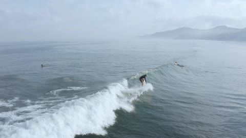 Surfer riding the waves