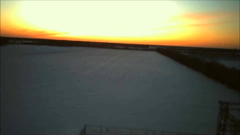 Drone view over the treeline of Sunset