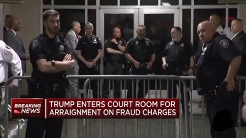 Donald Trump enters New York city courtroom following arrest processing