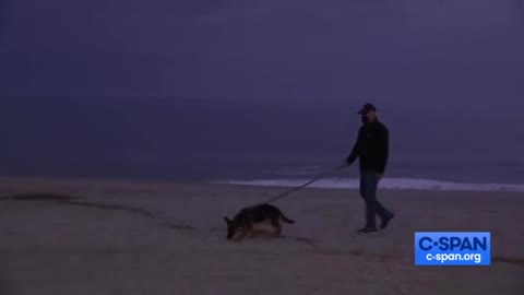 Biden wears mask on beach with no one around.