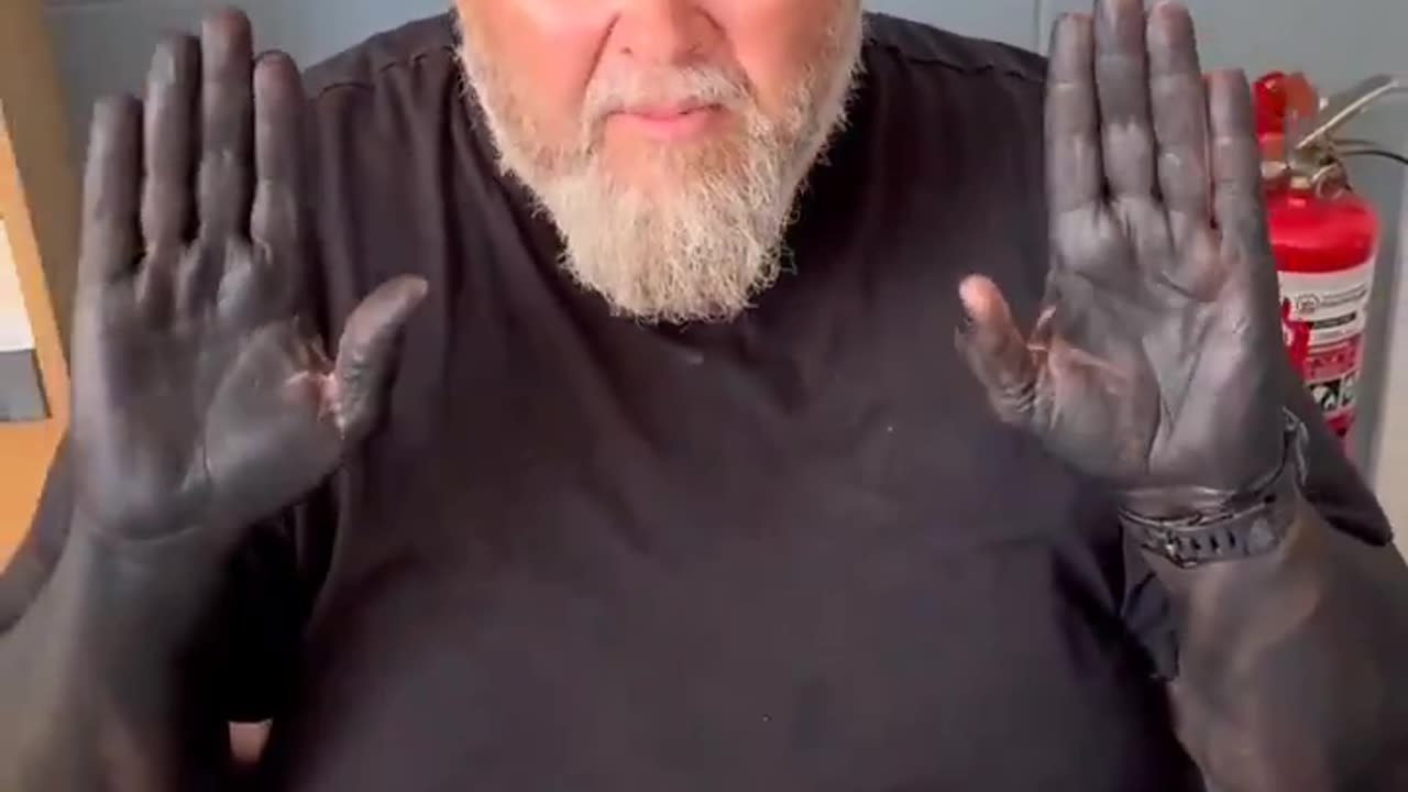 Man Rubbing Squid Ink On Himself