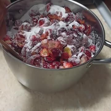 Mixing ingredients for cherry plum jam