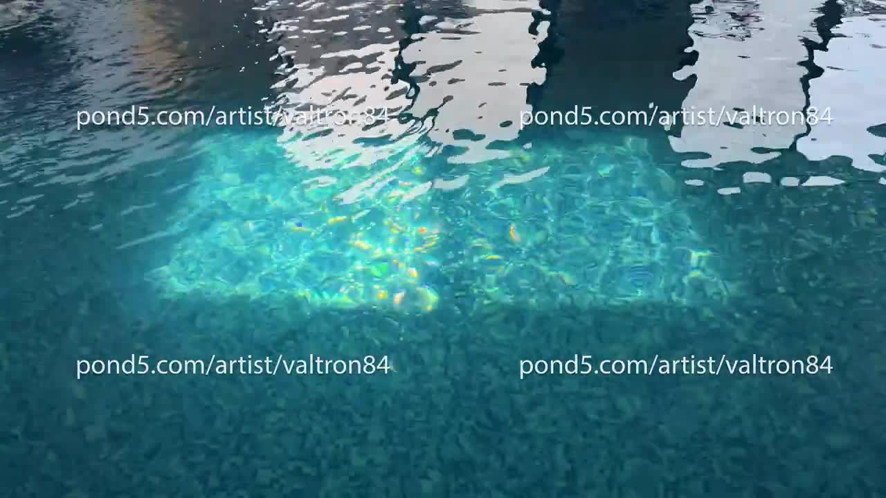 Empty Swimming pool with waterfall jet and jacuzzi in action