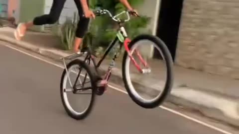 cycle wheeling by young girl