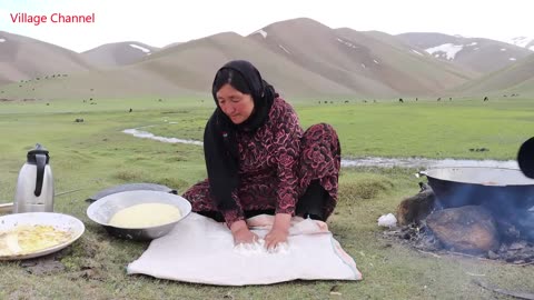 Shepherd Mother Cooking Shepherd food in the nature