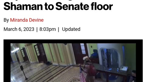 QAnon Shaman escorted through Capital building by police