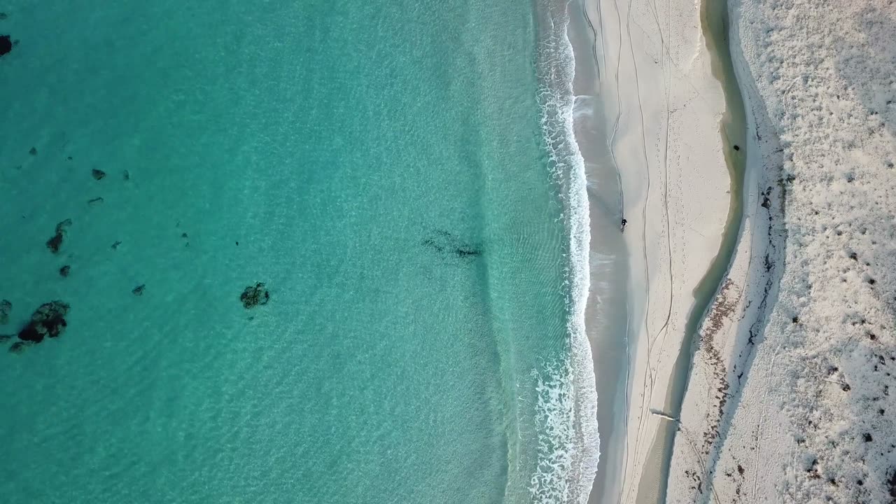 Bike Riders Ride on Beach