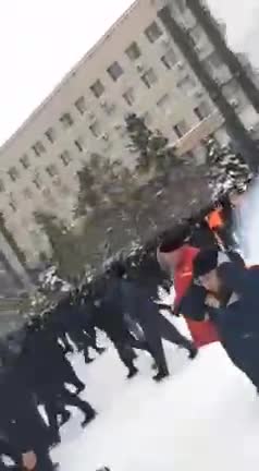Police use special means to push protesters away from the administration building in Aktobe