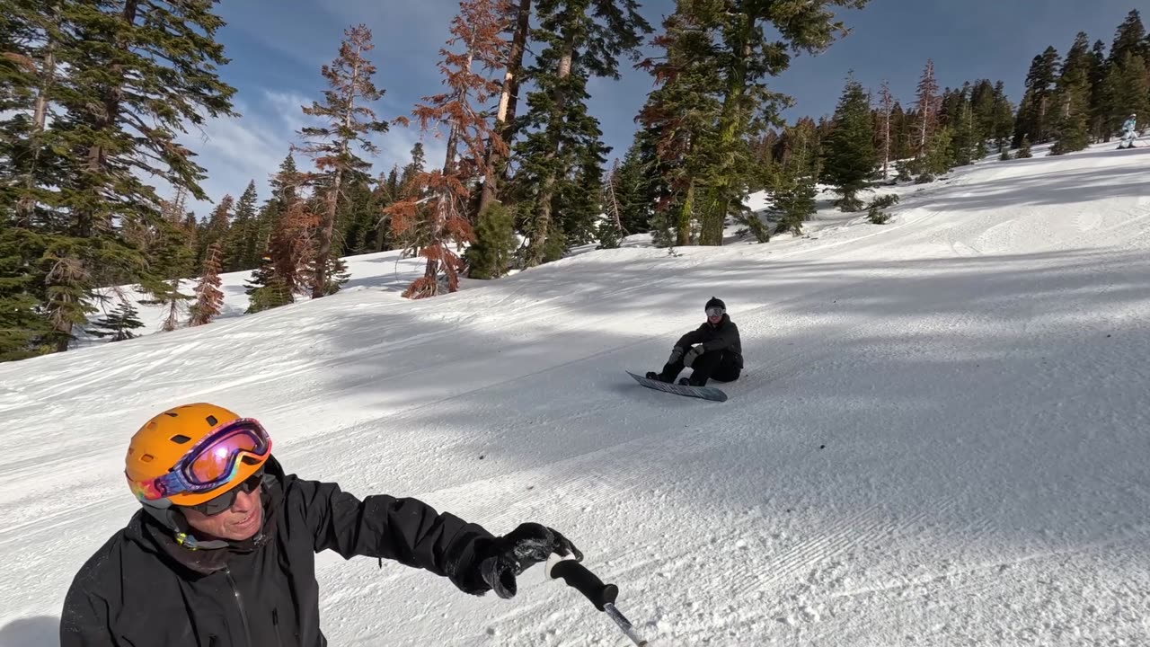 Snowboarder Collides with Skier, Causing a Fall Downhill