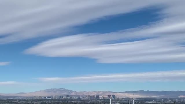 Hawk gliding easily over east Las Vegas.