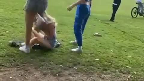 Two Girls Beat Up Another Girl While Another Records/Giggles