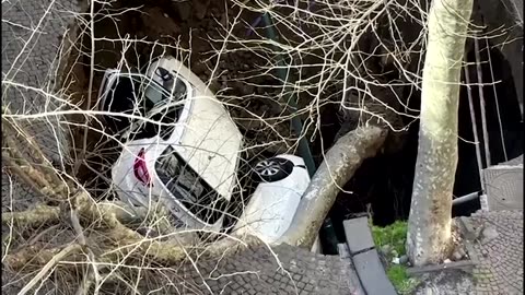 Two cars swallowed in Naples sinkhole