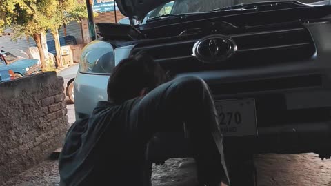 Mechanic Fixing Car