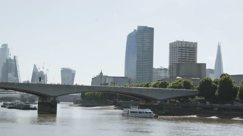 Waterloo Bridge With Commuter Traffic And London City Skyline In Background 2