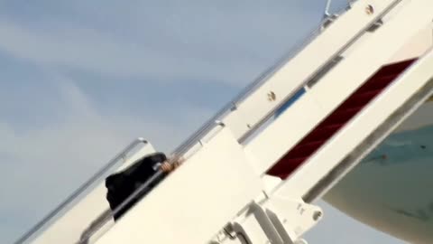 President Bidden falls down walking up steps of Air force one