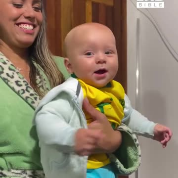 Baby copies his dad's flexes