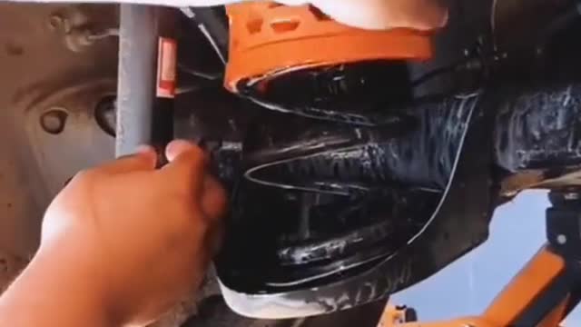 Car shock-absorbing spring installing protective sleeve for repairing car