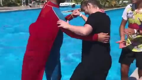 Superman takes lady for a water ride