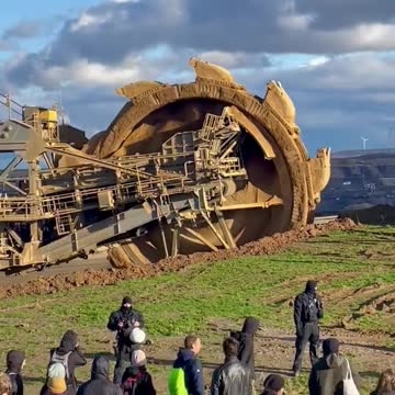 Activists rally to save German village from coal mine expansion, excavator comes to standstill