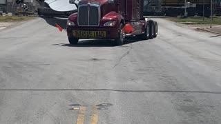 Train Cuts Through Wind Blade at Crossing