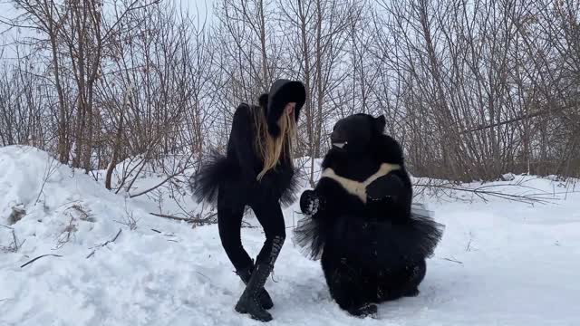 The girl danced ballet with the bear!