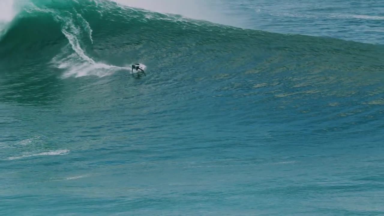 Surfers on Big Waves of Nazare, Feb 2023. Short film with epic music.