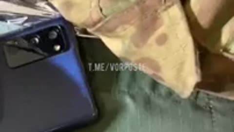 Smartphone of a wounded Ukrainian soldier that absorbed a bullet