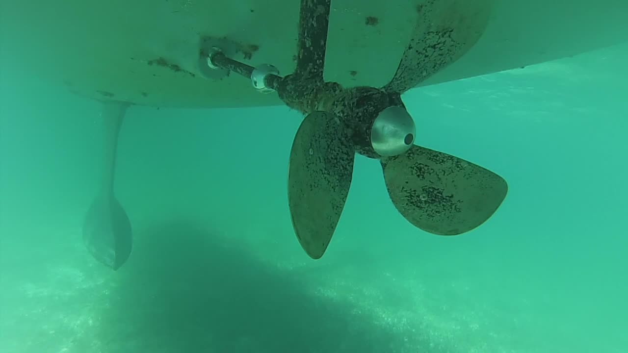 Diving under the boat to changing the sacrificial zincs.