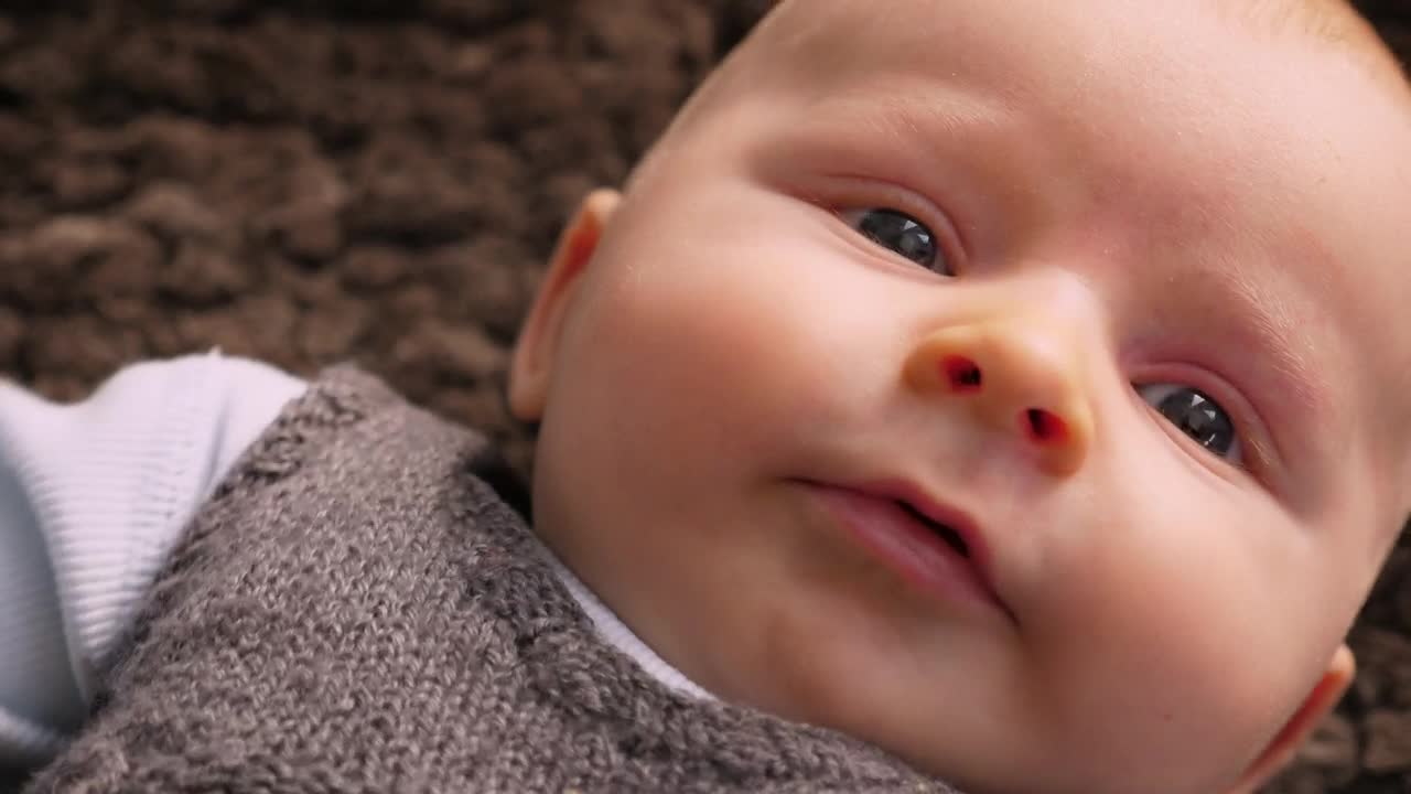 Young baby laying on the floor