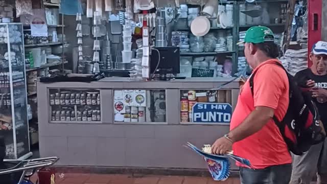 Mans Sells Flying Bird Toys in Venezuelan Market