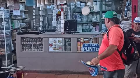 Mans Sells Flying Bird Toys in Venezuelan Market