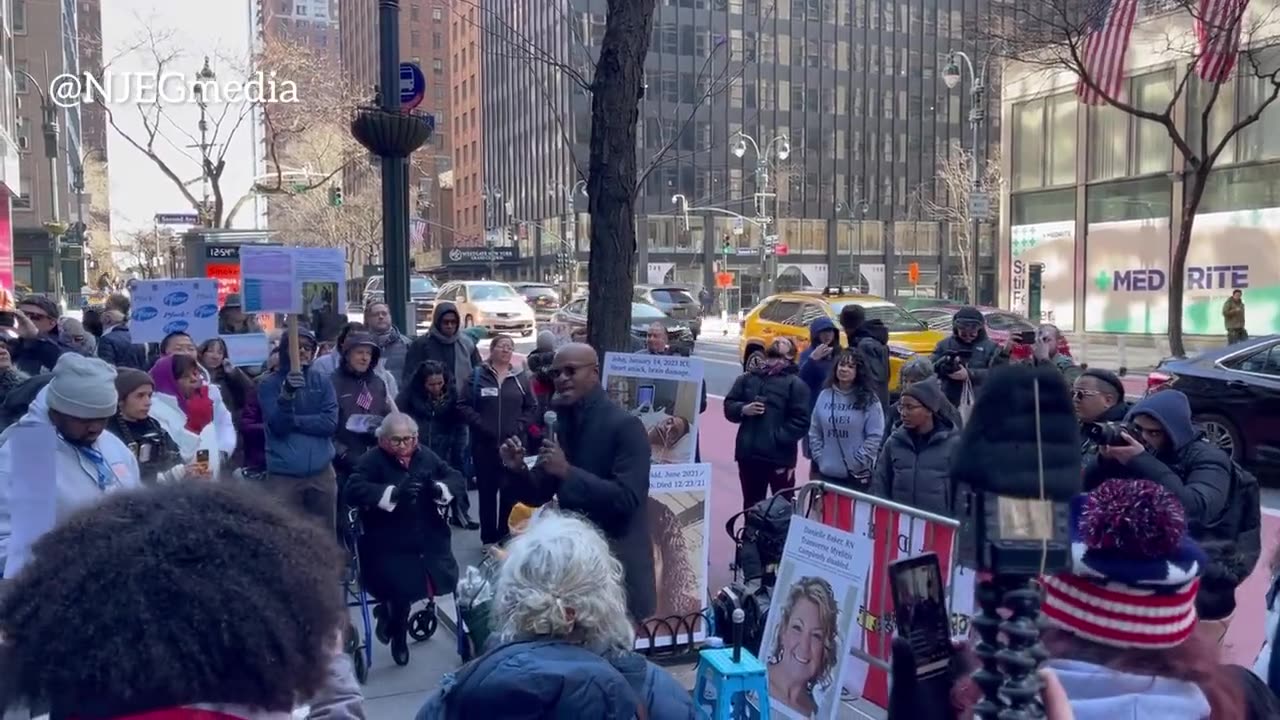 People gather outside Pfizer’s HQ to protest against “medical tyranny.