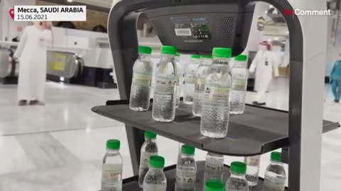 robots are distributing Zamzam previous water