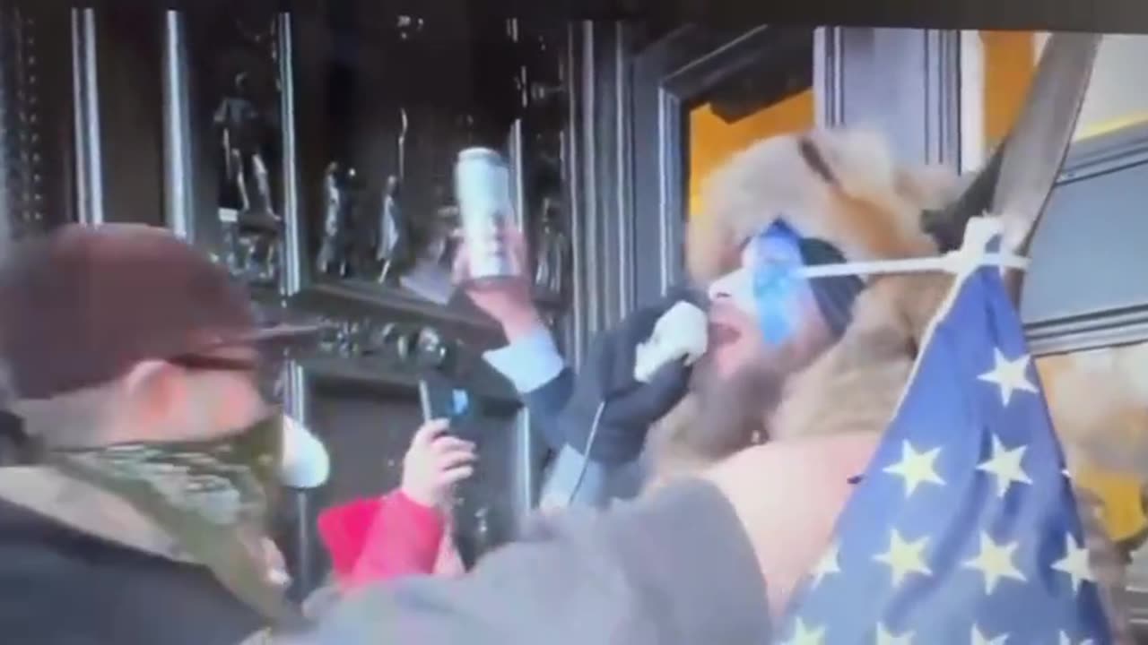 Q Shaman Stands Outside Doors of US Capitol and Tells Everyone to Go Home