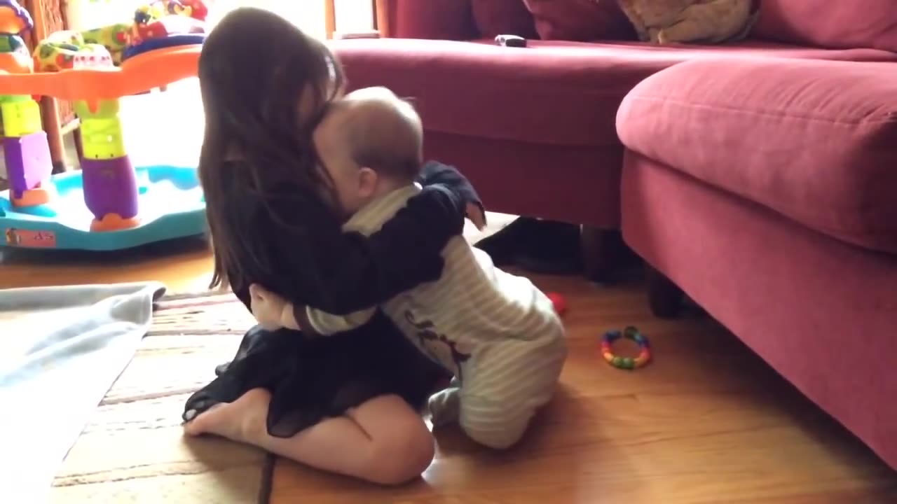 Precious moment between sister and baby brother