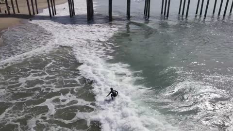 Kai Lenny surfing in Huntington Beach