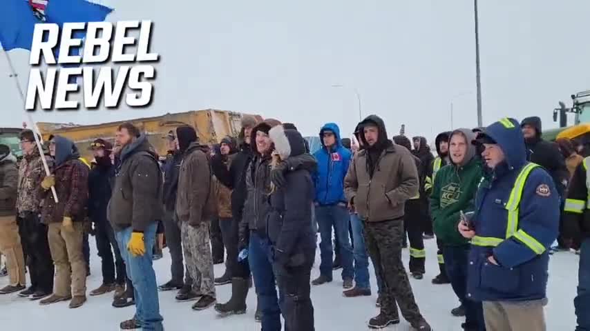 Truckers sing Canadian anthem as they stand their ground in face of threats