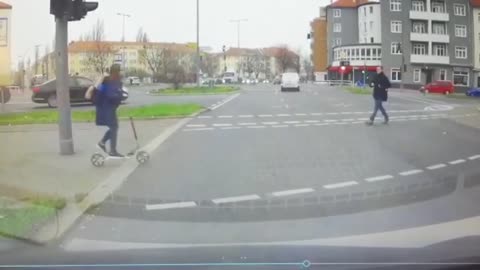 A Lady Running Falls Down While Trying To Cross The Road