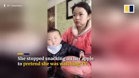 Chinese mum’s acting keeps food-loving baby from swiping her snack