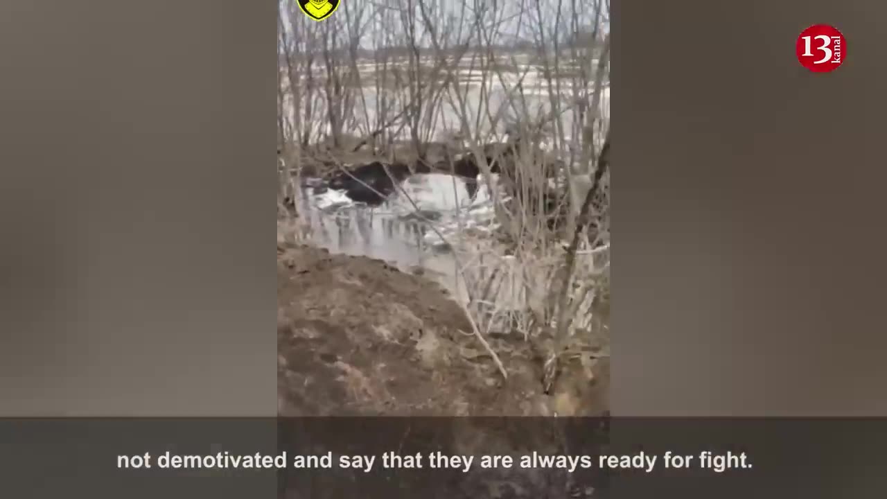 Ukrainian soldiers serving in a water-filled trench are under artillery fire