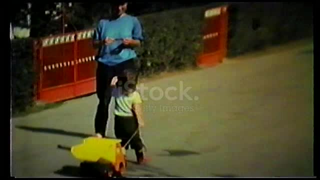 Boy in the street falling off to his truck toy four wheeler stock video