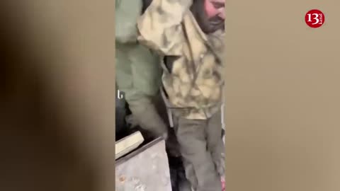 Russians hiding in a basement in Bakhmut surrender to Ukrainian fighters
