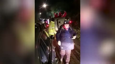 Pub-crawling Santas block Cornish road after getting army tank stuck in hedge