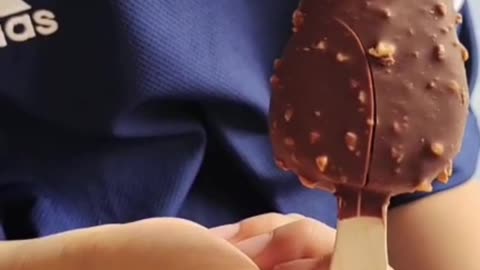 Happy little boy eating ice cream