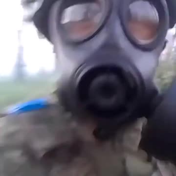 Colombian soldier wearing gas mask during alleged use of tear gas by Russians