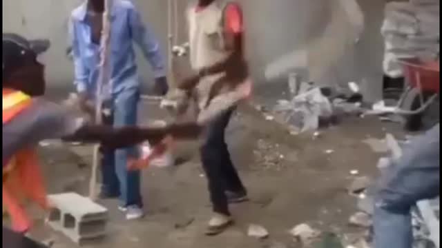 Funny african construction workers fighting